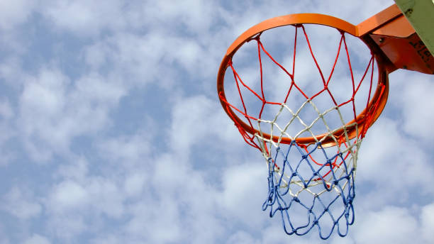 istock Basketball Hoop and Cloudy Blue Sky. 1175865891