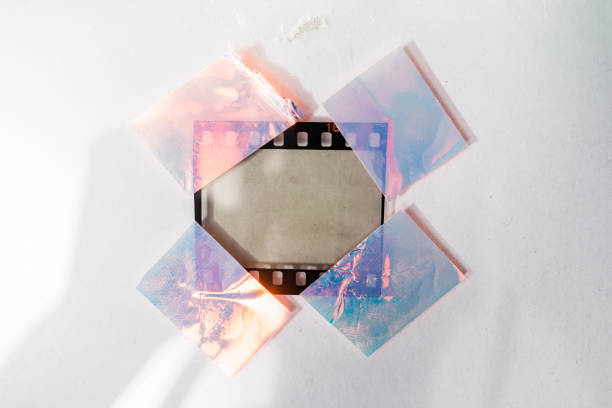 istock blank and empty 35mm film frame with shiny holo stickers on white background 1175866107