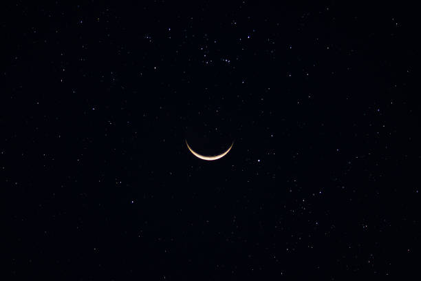 istock Crescent moon in the dark night with star. 1175868391