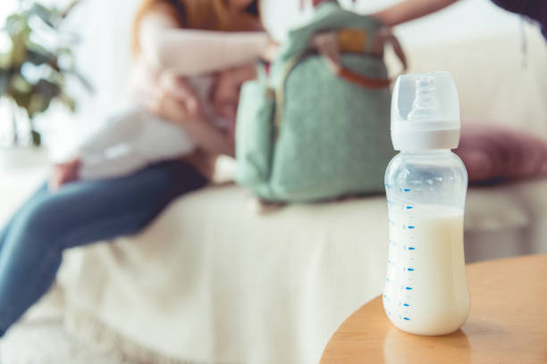 istock selective focus of bottle with milk on wooden table 1175868448