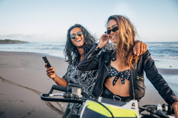istock Cute couple with motorcycle on the beach 1175870878