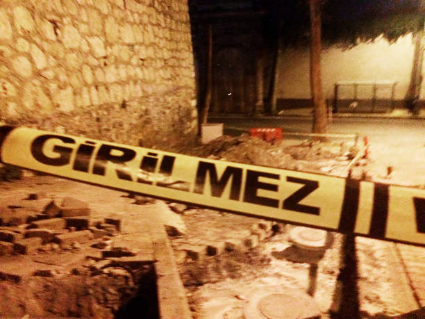 istock Yellow caution do not enter tape at a crime scene 1175872387