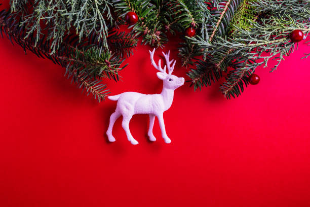 istock Creative layout made of Christmas tree branches and white Christmas reindeer 1175877034