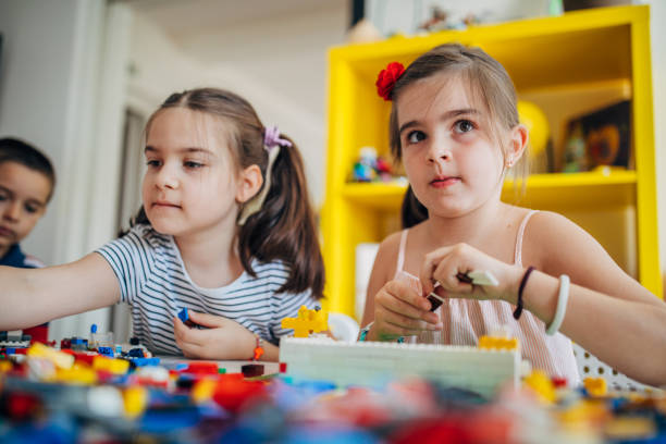 istock Kids playing with toy cubes 1175878594