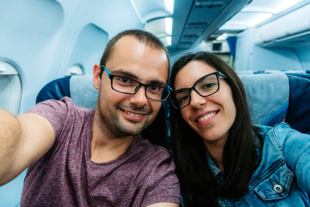 istock Couples selfie in airplane 1175879327