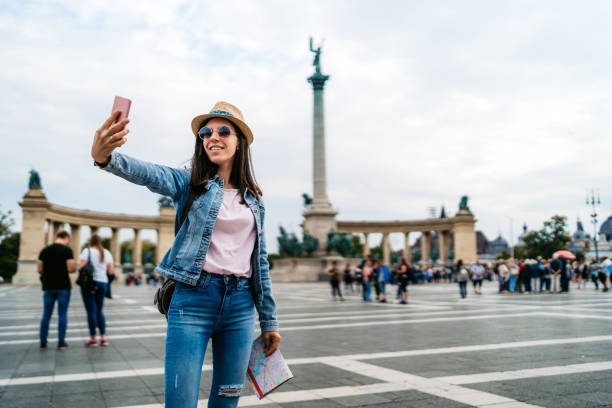 istock Young female tourist making selfies 1175886639
