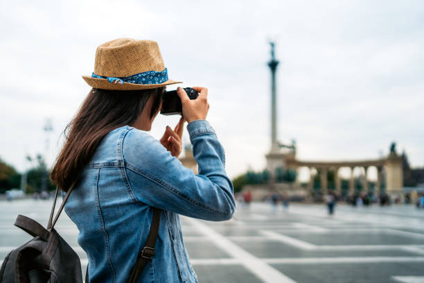 istock Young female tourist taking photos 1175886661