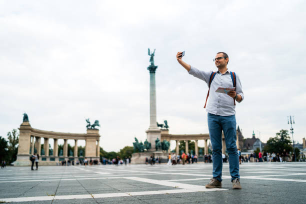 istock Young male tourist making selfies 1175886679