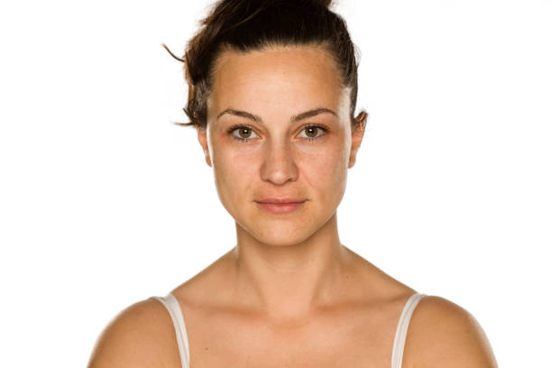 istock young woman without makeup on white background 1175888523