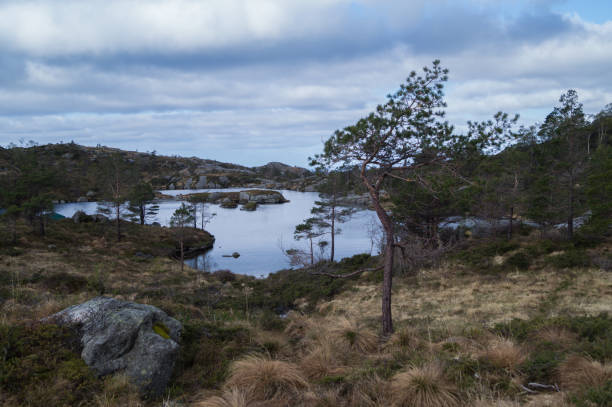 istock Norwegian mountain lakes with clouds 1175890595