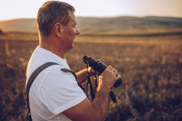 istock The farmer views the wheat farming field 1175891197