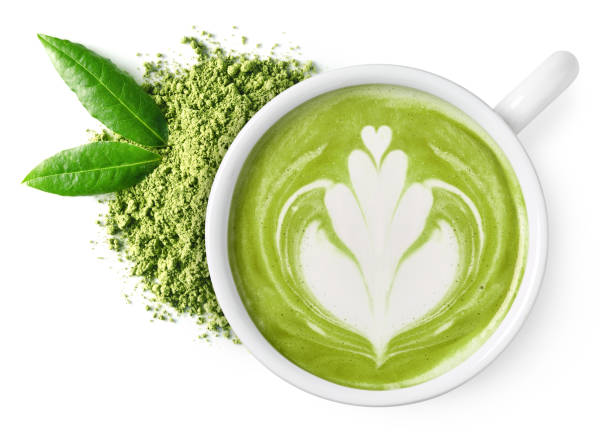 Cup of green tea matcha latte Cup of green tea matcha latte foam art with powder and fresh leaves isolated on white background, top view matcha tea stock pictures, royalty-free photos & images