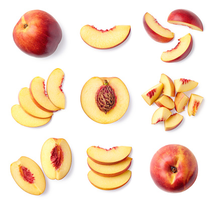 Set of fresh whole and sliced nectarine fruit isolated on white background, top view