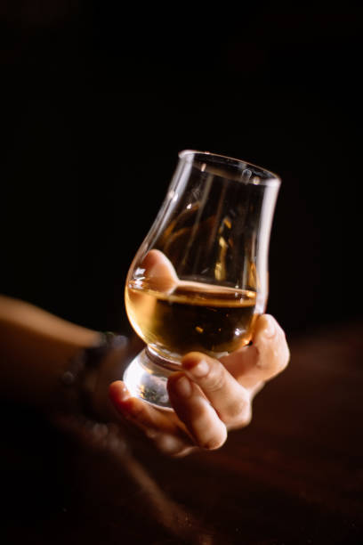 istock Hand holding a Glencairn whisky glass 1175894077