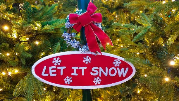 istock Christmas tree with yellow lights and ribbon 1175894375