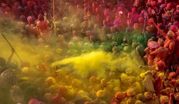 Photo of Men from Nandgaon sit in a Samaaj or community gathering during the festival of Holi, Mathura, Uttar Pradesh, India