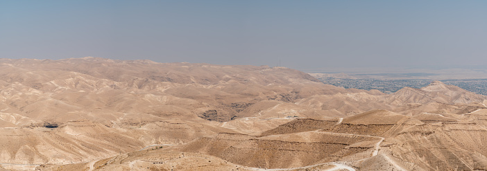 View of the Mountains and Caves In the Palestinian Desert With Jericho in the Background