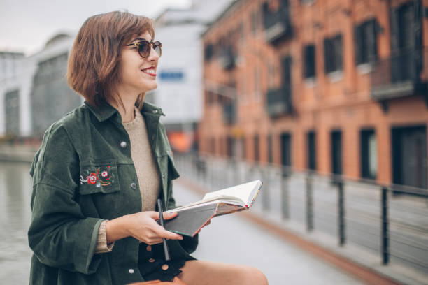 istock Woman in city by the river 1175897063