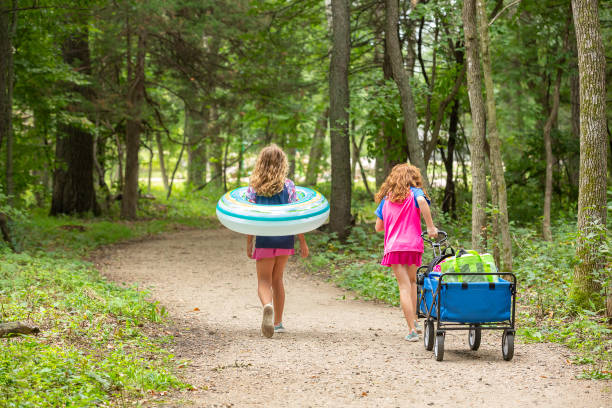 Girls Walking on Path Through Woods To Beach