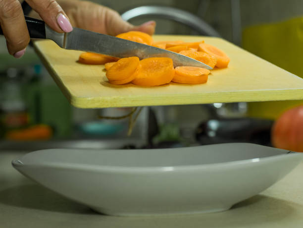 istock sliced carrots on a wooden board 1175901063