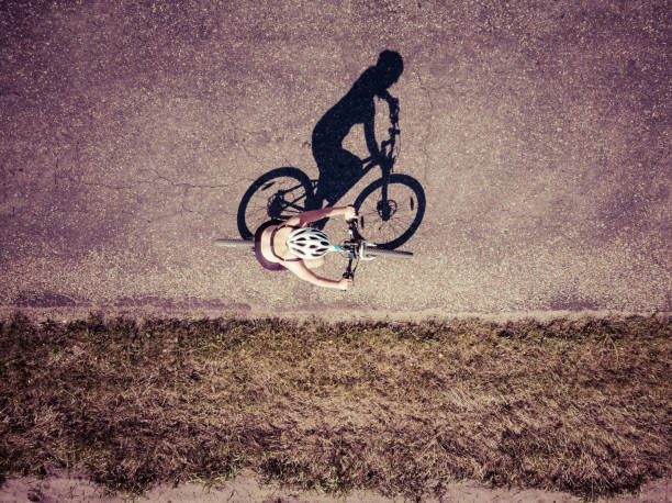 Shadow of the bicycle and cyclist sepia look