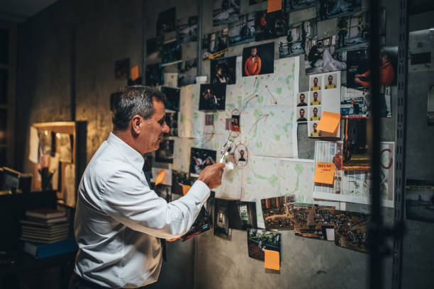 istock Mature detective working late in office 1175904199