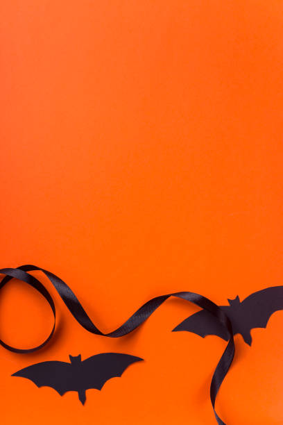 istock Black halloween characters and accessories on a bright orange background 1175904834