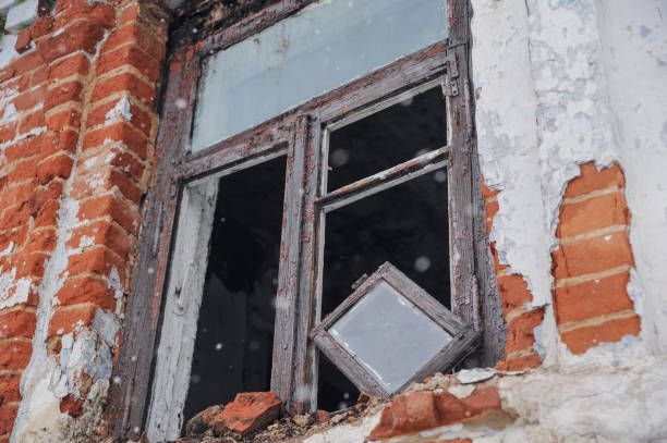 istock Old damaged window in abandoned house 1175905413