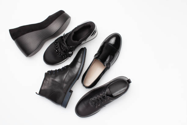 istock Different black leather women autumn shoes on white background 1175905985
