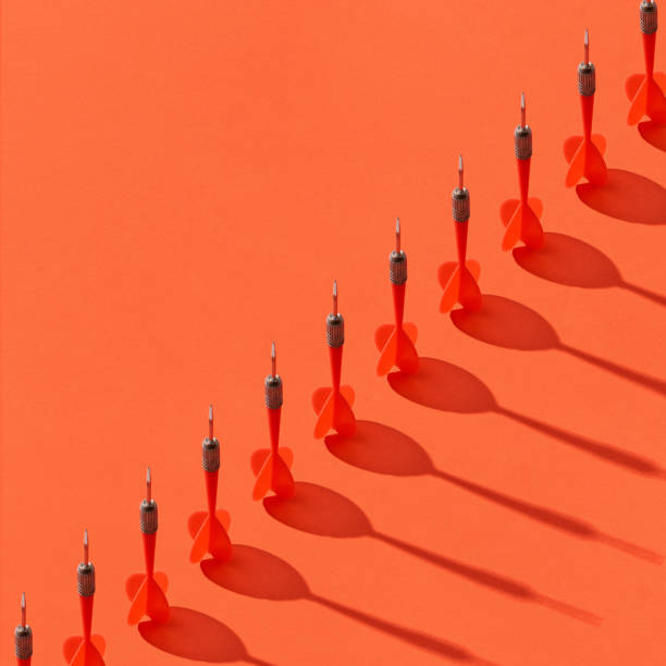 istock Diagonal line of darts with shadows. 1175906787
