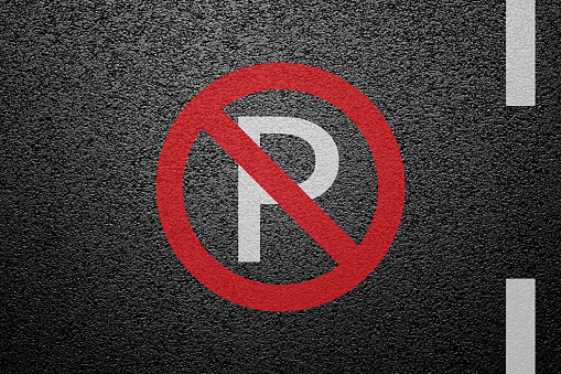 No Parking Sign on asphalt ground