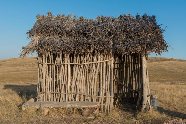 ancient man. straw roof hut, bungalow. Construction for housing