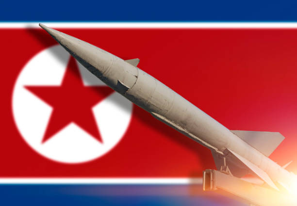 istock Rocket against the background Flag of North Korea 1175909715