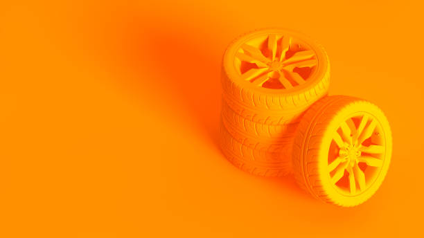 istock Conceptual stereoscopic image. Car wheels isolated on orange background. 1175914585