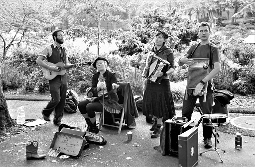 One of the many music groups playing around Seattle Center Park at Folklife Festival 2005.  In black and white film.