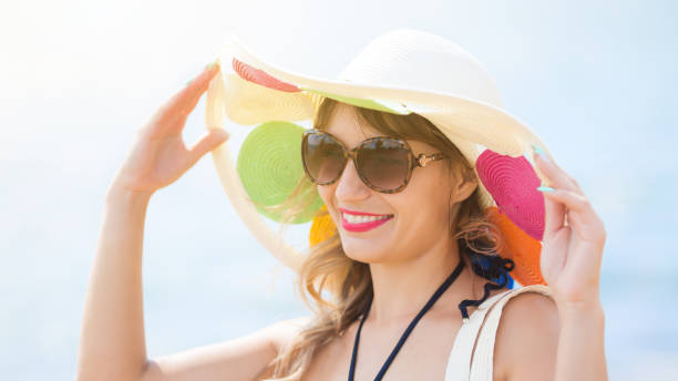 istock Woman in a hat and sunglasses 1175915333