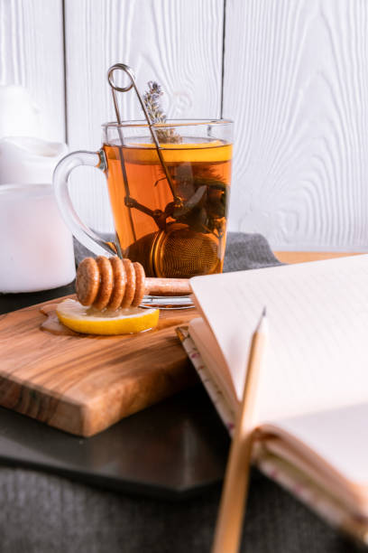istock Autumn Still Life with Tea with Lemon and Honey. Diary for Records 1175916252