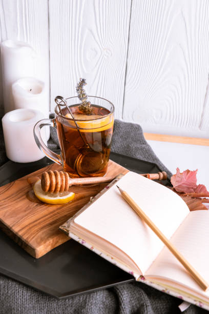 istock Autumn Still Life with Tea with Lemon and Honey. Diary for Records 1175916303