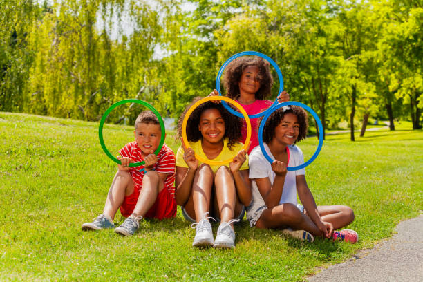 istock Group of cool kids portrait looking through hoops 1175916467