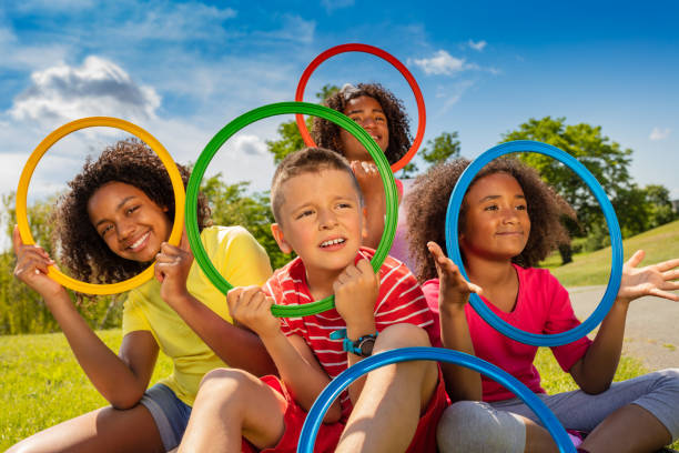 istock kids look through color hoops with funny portraits 1175916558