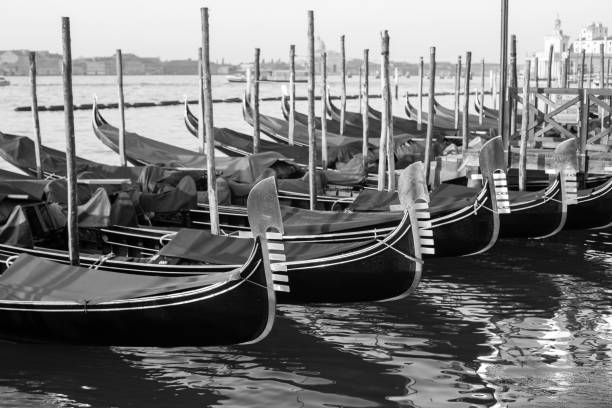 istock Gondolas by Saint Mark square at sunrise, Venice, Ita B&Wly 1175922132