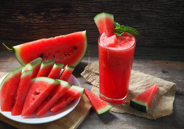 Watermelon Juice, Healthy watermelon smoothie and mint Mint leaf on a wooden background