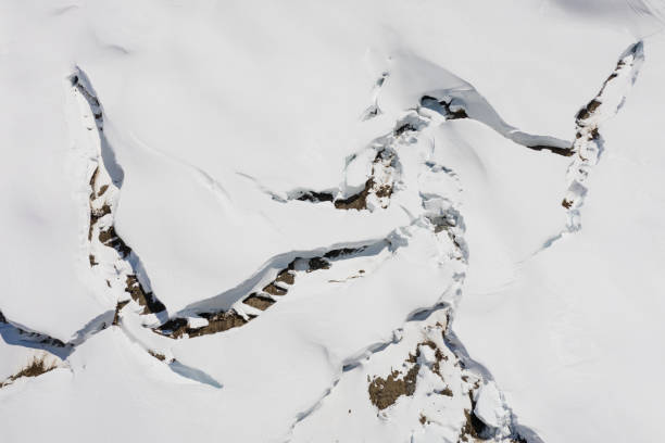 Crack on the glacier. Fault in a glacier, a dangerous crack in the ice on the snowy slope of a glacier.