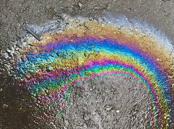 istock Oil spill on asphalt road 1175925301