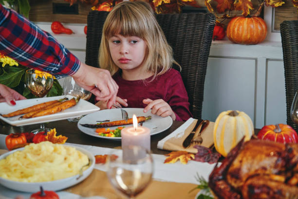 istock Family Having Traditional Holiday Stuffed Turkey Dinner 1175925709