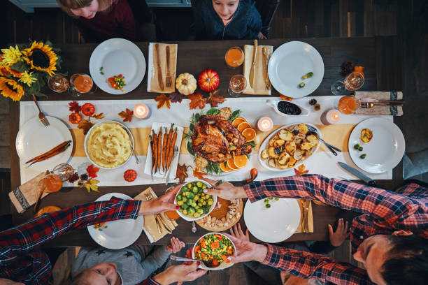 istock Family Having Traditional Holiday Stuffed Turkey Dinner 1175925712