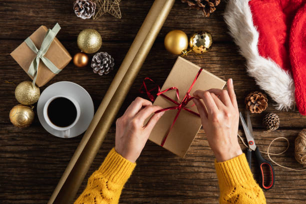 istock Hands wrapping christmas gifts 1175925805