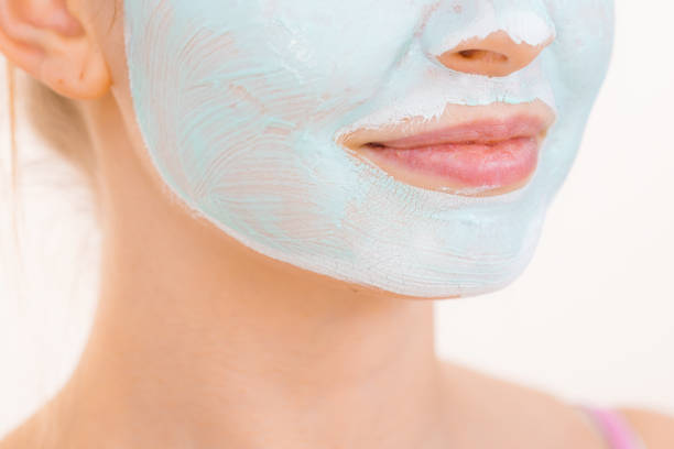 istock Girl green mud mask on face 1175926873