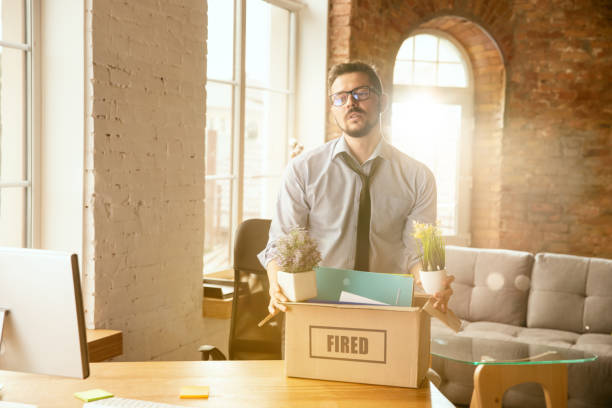 istock Young businessman fired, looks upset 1175931275
