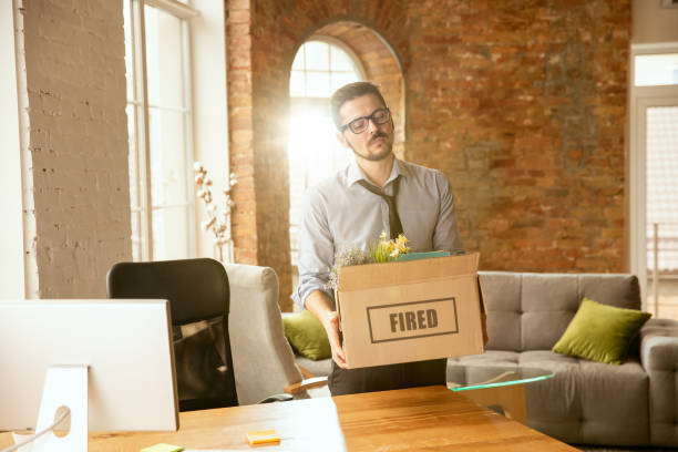 istock Young businessman fired, looks upset 1175931289